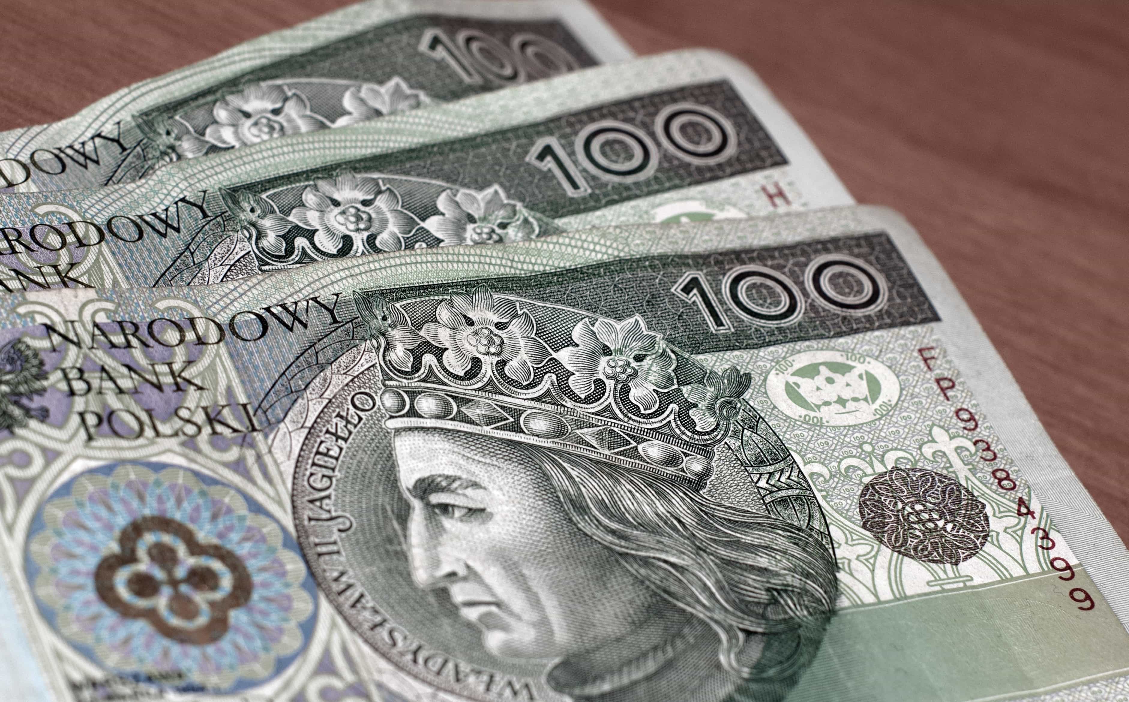 Monety i banknoty jako ilustracja świadczeń finansowych